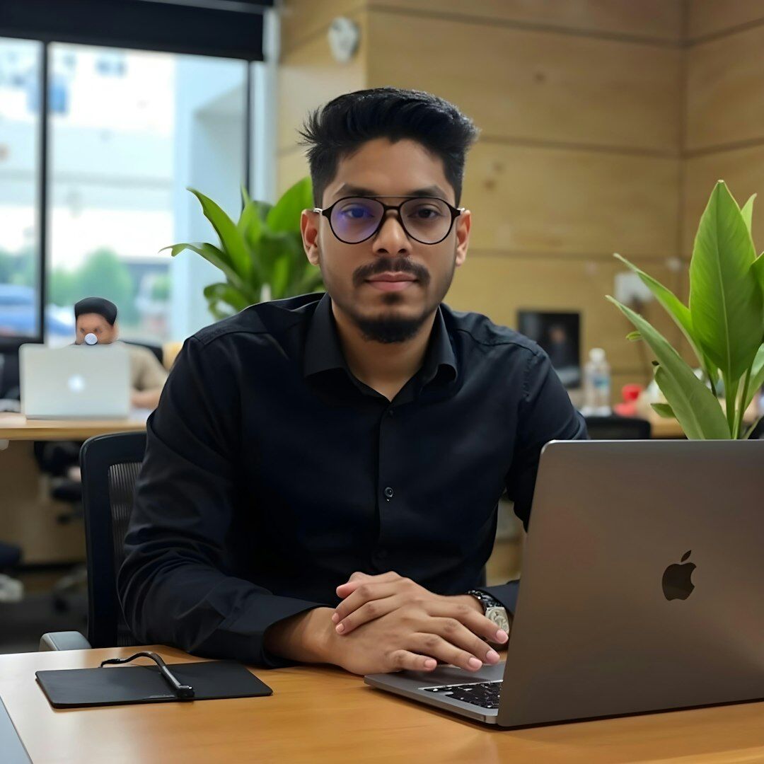 Professional portrait of male technology analyst with glasses